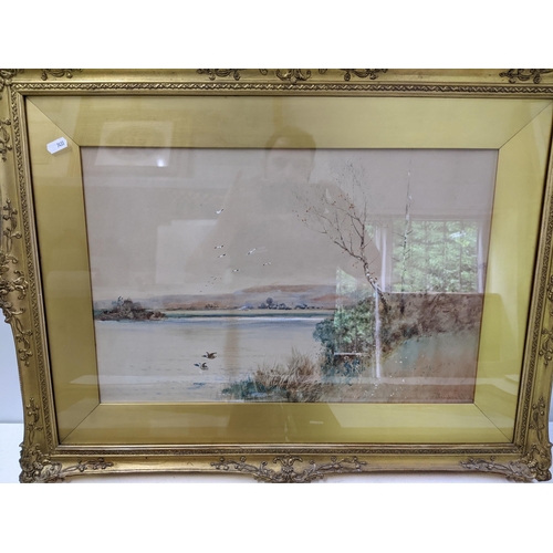 539 - Three gilt framed pictures to include two lake scenes, both signed S Wilson, and another lake scene ... 