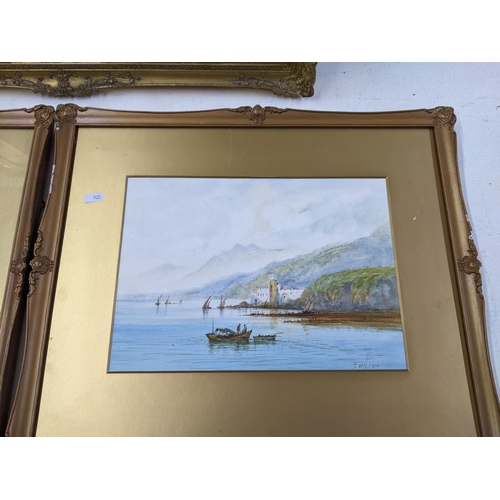 539 - Three gilt framed pictures to include two lake scenes, both signed S Wilson, and another lake scene ... 