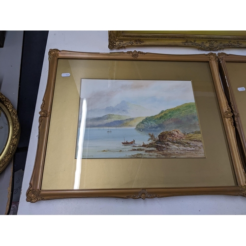 539 - Three gilt framed pictures to include two lake scenes, both signed S Wilson, and another lake scene ... 