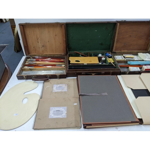 560 - Artist's equipment to include five handled cases containing paint, pencils, brushes, oils and other ... 