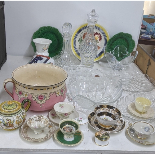 574 - A mixed lot of ceramics and glassware to include two crystal cut glass decanters, a Fanciullacci tea... 