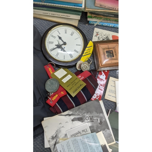 524 - A mixed lot to include an RAF jacket, books, aviation photographs and other items Location:RAF
If th... 