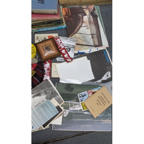 524 - A mixed lot to include an RAF jacket, books, aviation photographs and other items Location:RAF
If th... 