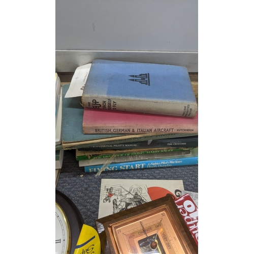 524 - A mixed lot to include an RAF jacket, books, aviation photographs and other items Location:RAF
If th... 