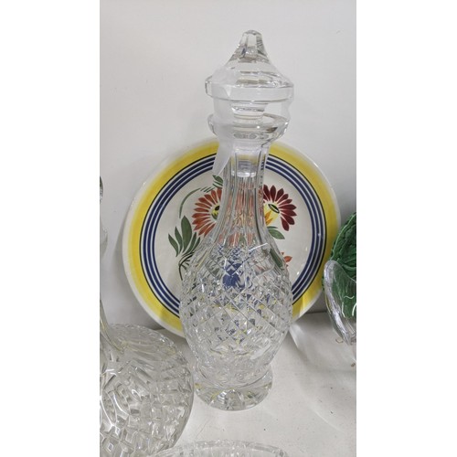 574 - A mixed lot of ceramics and glassware to include two crystal cut glass decanters, a Fanciullacci tea... 