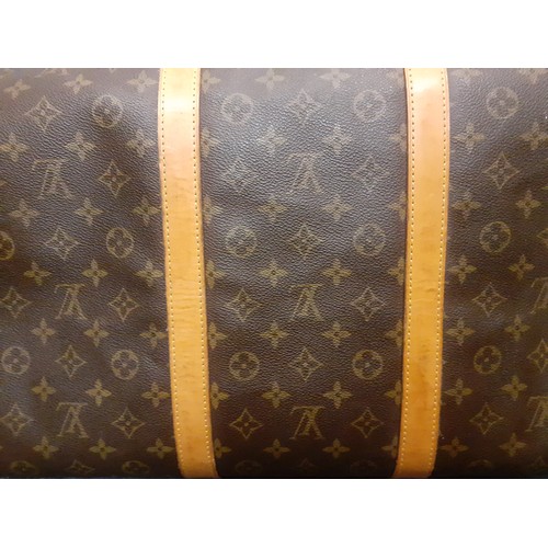 4 - Louis Vuitton-An LV monogram keepall 60 canvas bag, leather trimmed with double leather handles and ... 