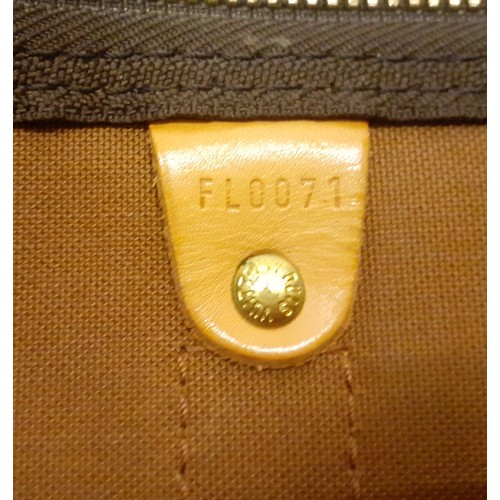 4 - Louis Vuitton-An LV monogram keepall 60 canvas bag, leather trimmed with double leather handles and ... 