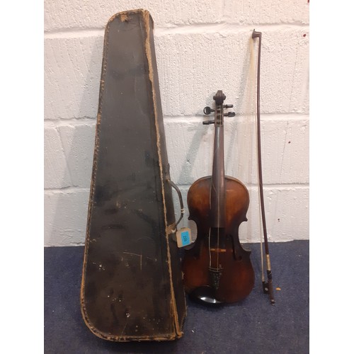 220 - An early 20th Century violin A/F  back measurement 35cm, total length 60cm with bow A/F and fitted c... 