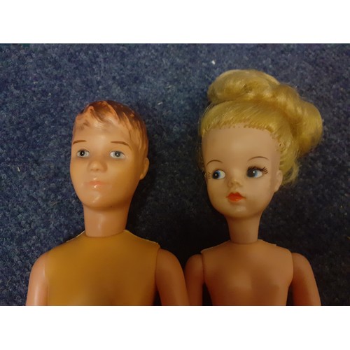 227 - A 1960's Made in Hong Kong Sindy and a 1960's Paul doll together with clothing to include Sindy and ... 