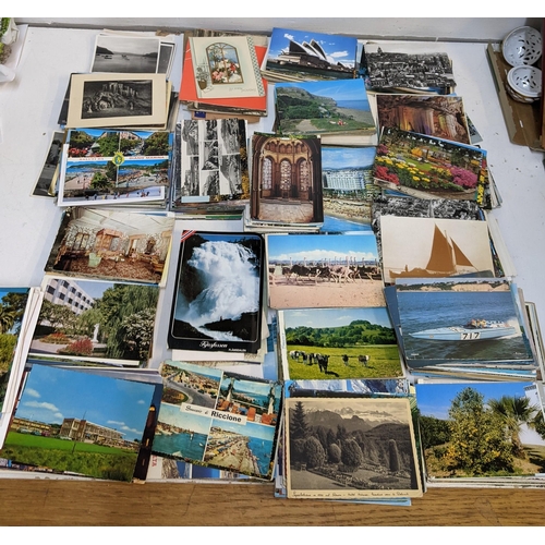 226 - A large collection of postcards from across the world to include examples from Mongolia, Portugal, M... 