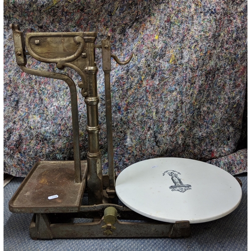 293 - A Victorian butcher's shop scales with a white glazed weighing plate 53cm h x 62cm w Location:A4B
If... 