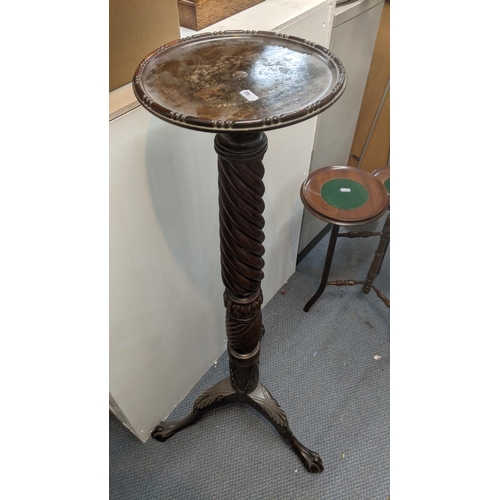 306 - A 1920's mahogany torchiere stand together with an early 20th century mahogany three tier cake stand... 