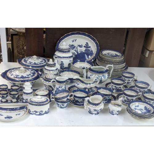 312 - A Royal Doulton Real Old Willow part dinner/tea service to include a tureen, sauce boat, cups and sa... 