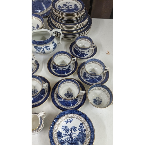 312 - A Royal Doulton Real Old Willow part dinner/tea service to include a tureen, sauce boat, cups and sa... 