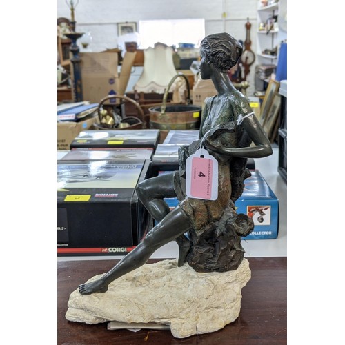 618 - A bronze composite figure of a young boy playing (possibly) the flute on a naturalistic base, signed... 