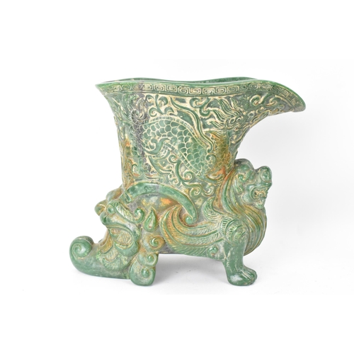 631 - A 20th century Chinese carved green soapstone vase/ drinking vessel, the upper vessel carved in reli... 