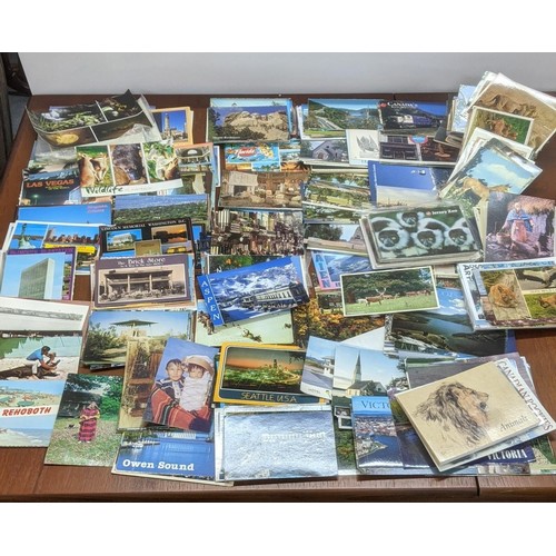 624 - Four postcard albums to include postcards from Snowdon, Thompson River and others, along with a quan... 