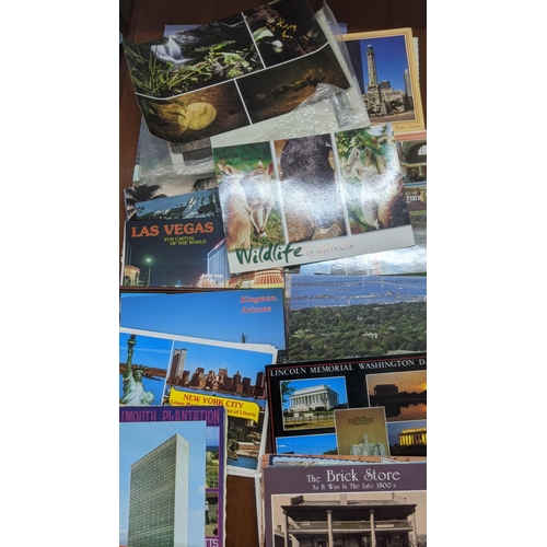 623 - A quantity of postcards, mainly from the USA and Canada, and others, along with a group of postcard ... 