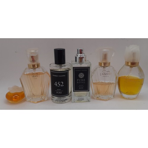 67 - A group of vintage partially filled perfume bottles and eau de toilettes to include 2 x Coty L'Aiman... 