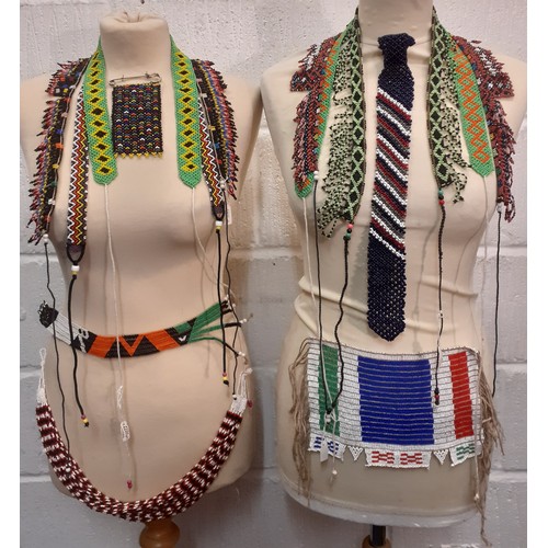 80 - A quantity of traditional ethnic beaded adornments to include Afghan belts and an African Zulu beade... 