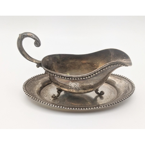 13 - A Watson sterling silver sauce boat and dish, total weight 80.5g 
Location: STAIRS
If there is no co... 