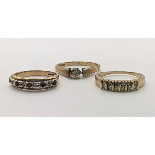 63 - Three 9ct gold ladies rings to include one set with diamonds, one with a diamond and rubies, togethe... 
