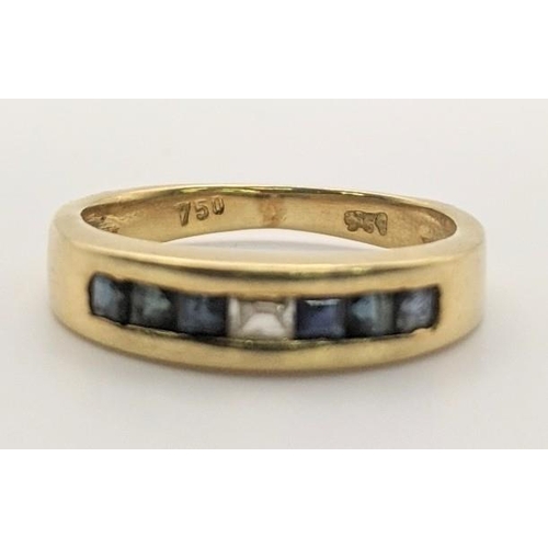 64 - A 18ct gold ladies ring, set with a central diamond and flanked by blue sapphires, 3.5g
Location: RI... 