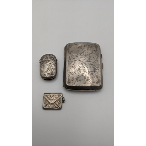 72 - Silver to include an engraved cigarette case, a vesta case and a stamp holder, all having floral eng... 