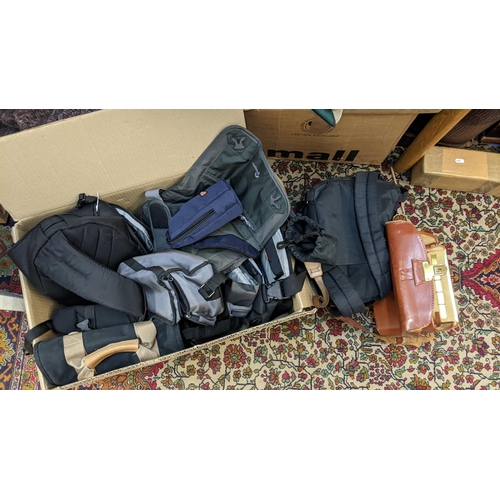 198 - Photographic  equipment to include mainly tripods, bags, a box and a flash
Location:A1M
If there is ... 