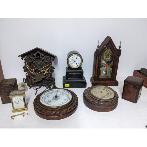 293 - A selection of Victorian and later clocks and wall barometer to include a Swiss wooden cased cuckoo ... 