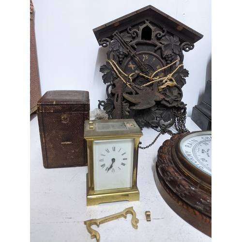 293 - A selection of Victorian and later clocks and wall barometer to include a Swiss wooden cased cuckoo ... 