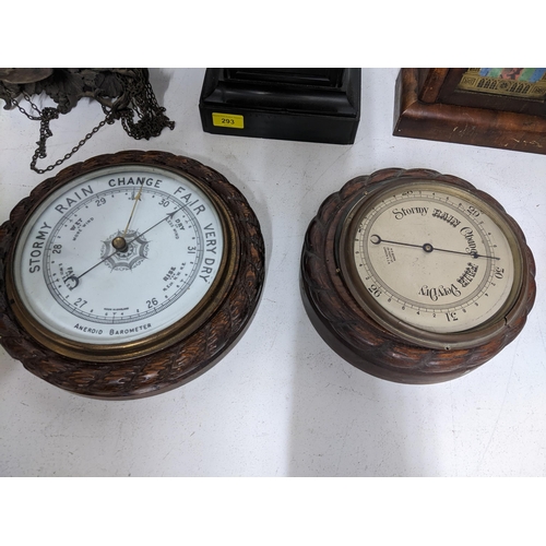 293 - A selection of Victorian and later clocks and wall barometer to include a Swiss wooden cased cuckoo ... 