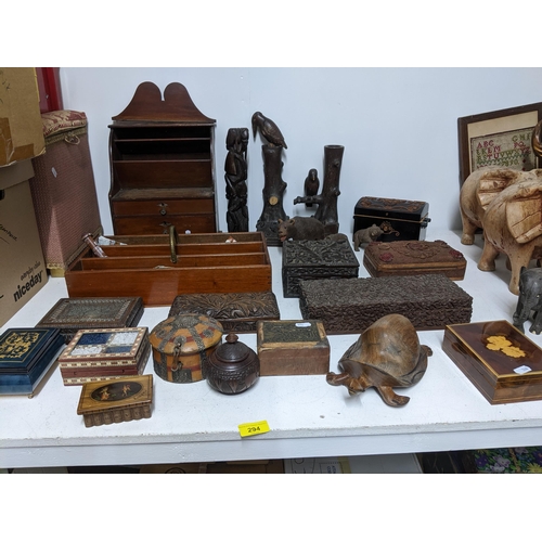 294 - A collection of treen wooden boxes and other items to include three black Forest carved bears, Sorre... 