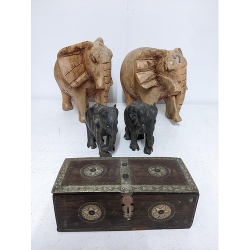 295 - A hardwood trinket box inlaid and mounted in white metal, and two pairs of carved wooden elephants L... 