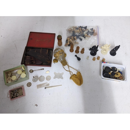 304 - A mixed lot to include Chinese mother of pearl counters, various wooden and plastic chess pieces, si... 