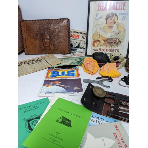 306 - A mixed lot of ephemera, books, TV related and props department items to include a severed head, 33r... 