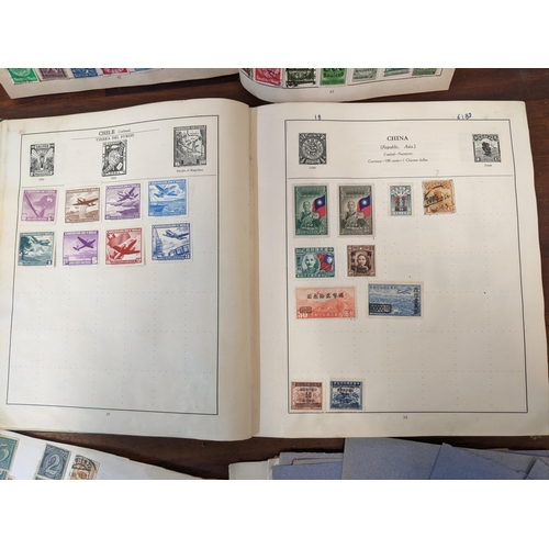 314 - Two early to mid century stamp albums and various loose stock pages containing world stamps, Chinese... 