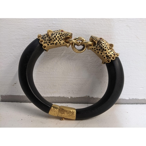 320 - The Franklin Mint replica Duchess of Windsor panther/ Leopard head bracelet, ebony wood with gold pl... 