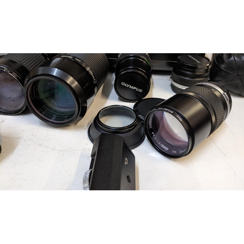 354 - An Olympus OM-1, A Kron 70-210mm a Tokina ATX, Suko lenses and accessories in a case
Location: 2-4
I... 