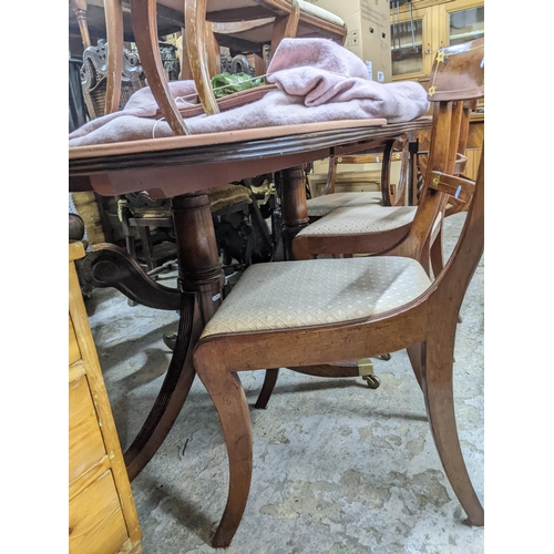 341 - A Regency mahogany twin pedestal dining table with one extra leaf, 73x 67 (un-extended) x 99cm, with... 