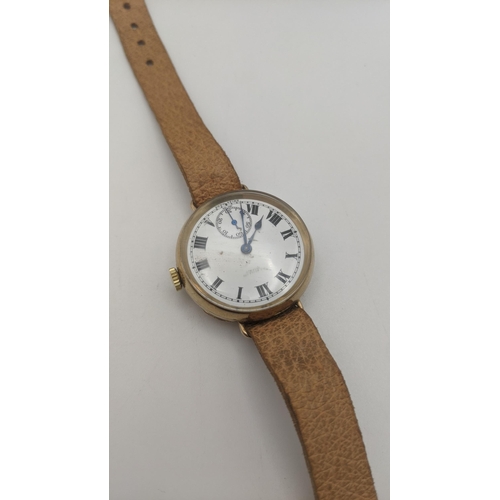 101 - A 9ct gold S D Neileite Helfast gents wristwatch on a brown leather strap, total weight 24.4g, Locat... 