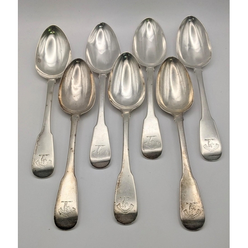 104 - A set of seven Scottish silver fiddle pattern serving spoons, hallmarked Edinburgh 1821, total weigh... 