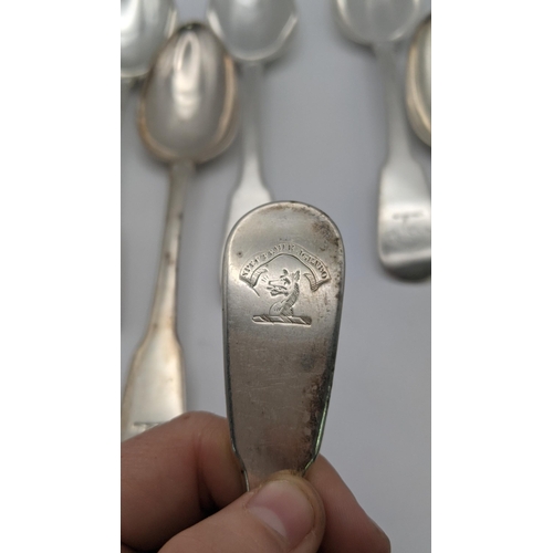 104 - A set of seven Scottish silver fiddle pattern serving spoons, hallmarked Edinburgh 1821, total weigh... 