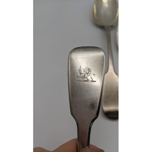 105 - Silver fiddle pattern serving spoons, to include three English spoons and one Irish spoon, total wei... 