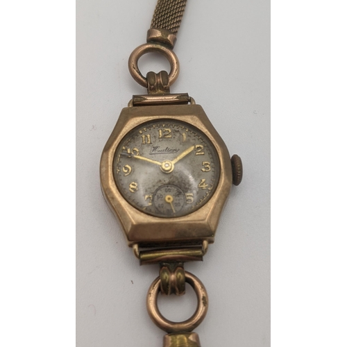 106 - A 9ct gold ladies Hudson manual wind wristwatch on a gold plated strap, total weight 15.1g, together... 