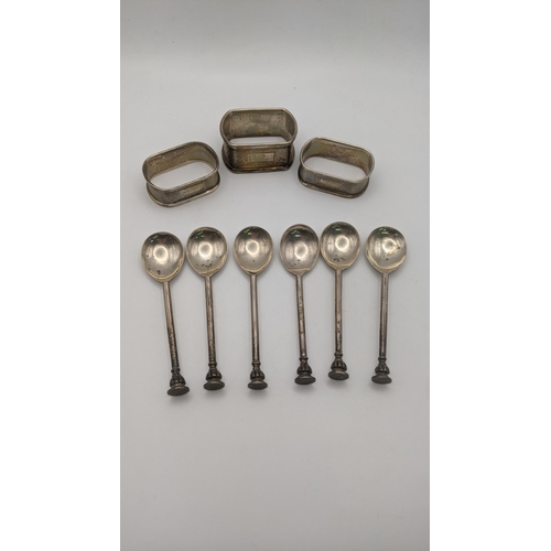 113 - Six silver tea spoons, five of them dated Sheffield 1924 together with three silver napkin rings, to... 