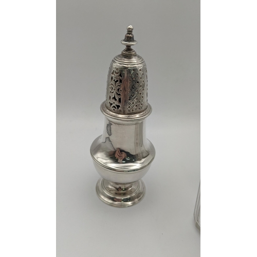 117 - A silver sugar caster hallmarked London 1892, together with three silver lidded dressing table jars,... 