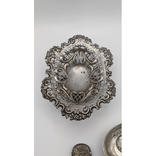 118 - Silver to include a William Comyns and Sons pierced pin dish, hallmarked London 1891, a floral embos... 