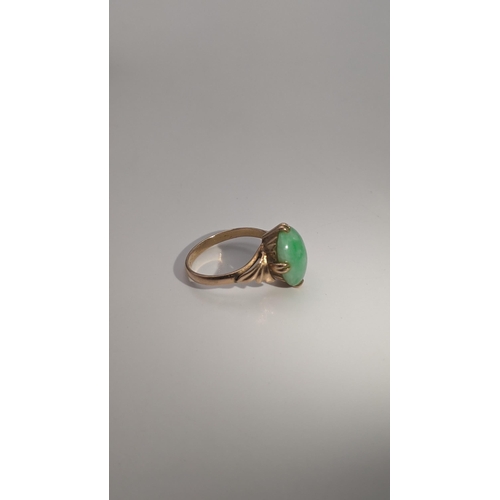 130 - A gold and jade ring tested as 14ct gold, size N, 3.3g Location: CAB 1
If there is no condition repo... 