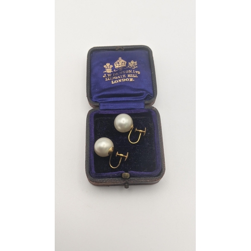 133 - A pair of 9ct gold and pearl ciro screw back earrings 7.2g
Location: CAB 7
If there is no condition ... 